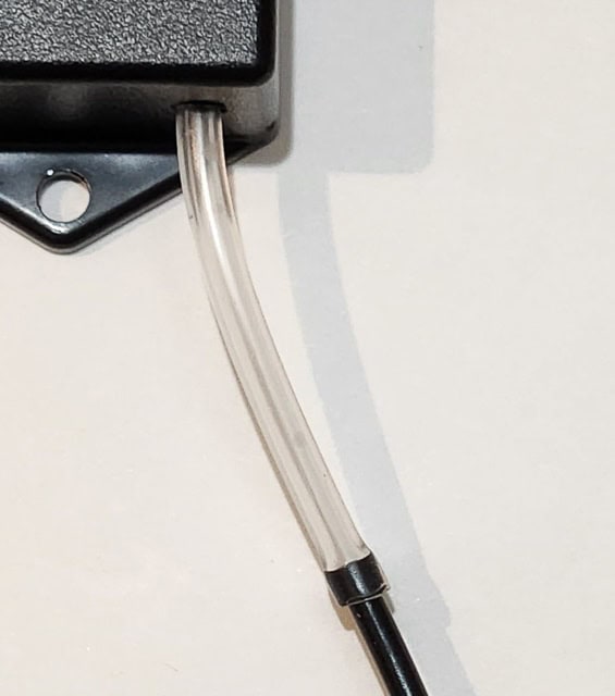 a black hose pushed  inside a transparent one