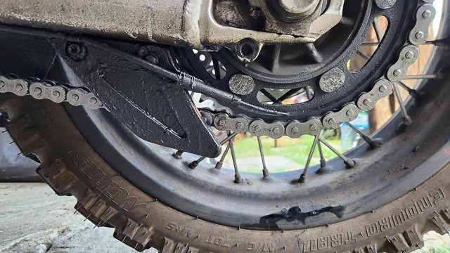 view of a procket and hose lightly touching it at 6 o'clock position