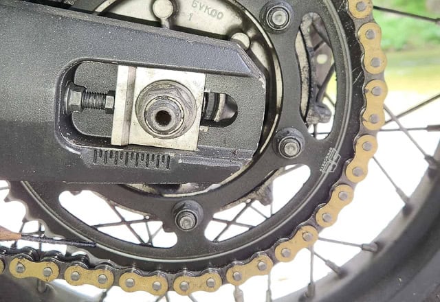 view of a procket and hose lightly touching it at 7 o'clock position